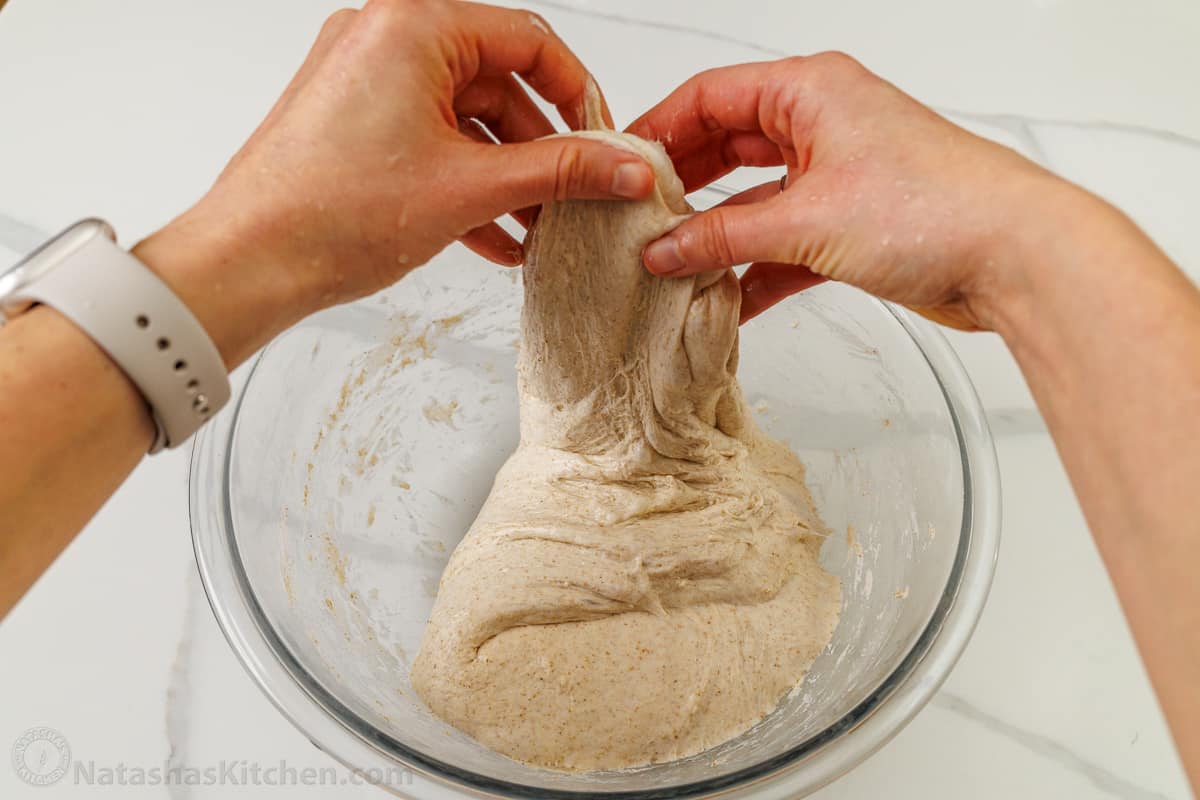 Stretching the sourdough bread dough during bulk fermentation