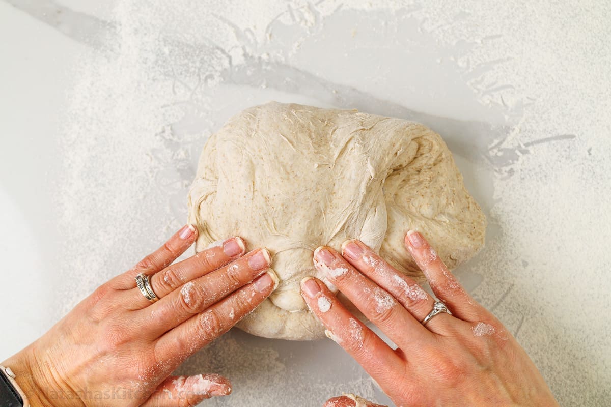 Shaping the boule using hands for Natasha's sourdough bread recipe