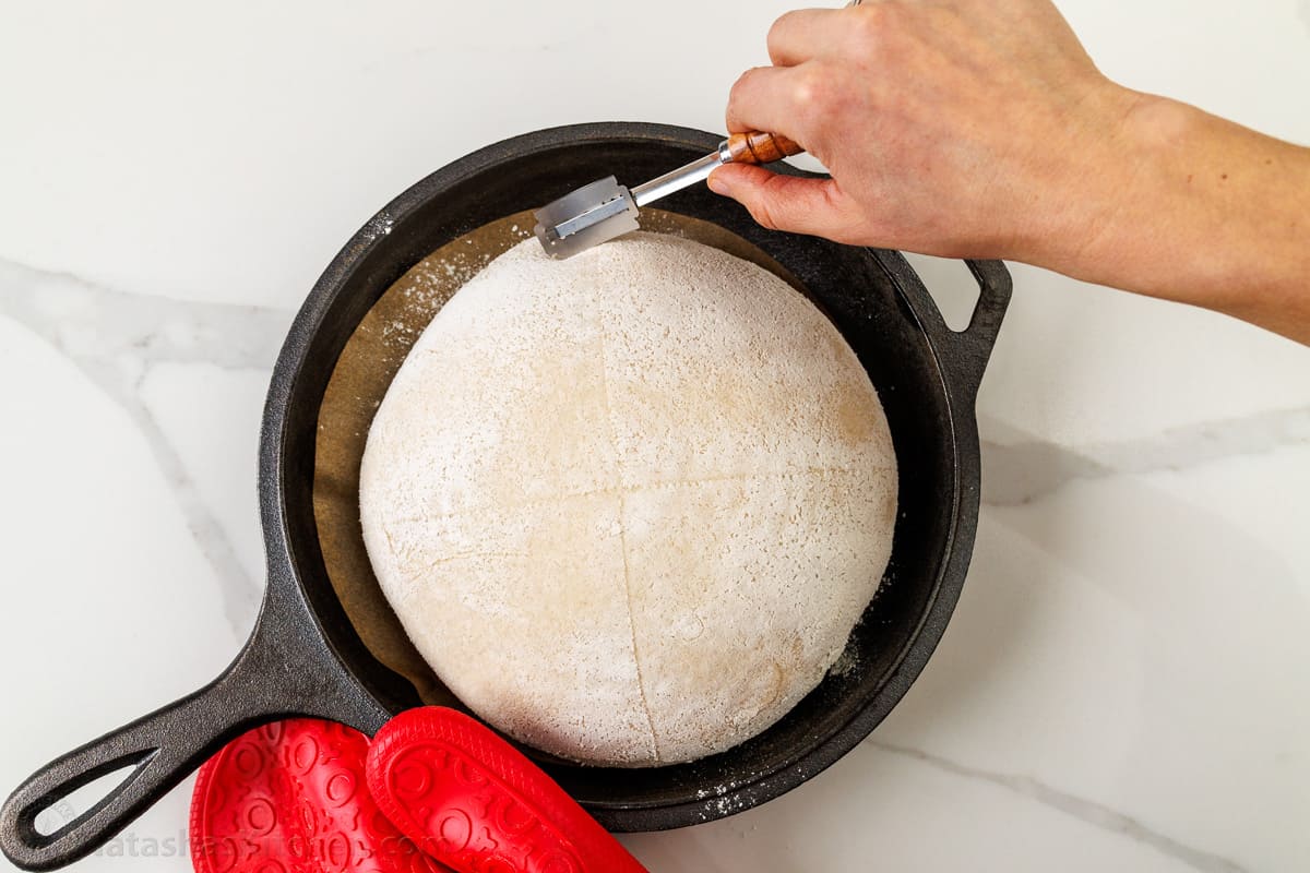 Scoring sourdough bread dough using a bread lame