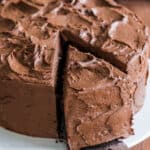 Chocolate cake frosted with a slice cut out