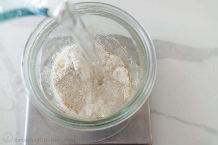 Feeding starter with water and flour