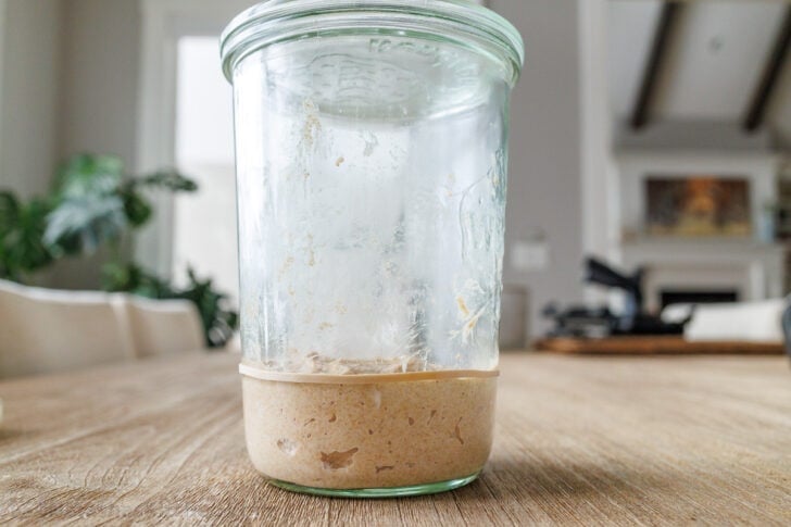 Jar with flour and water mix and rubber band on jar