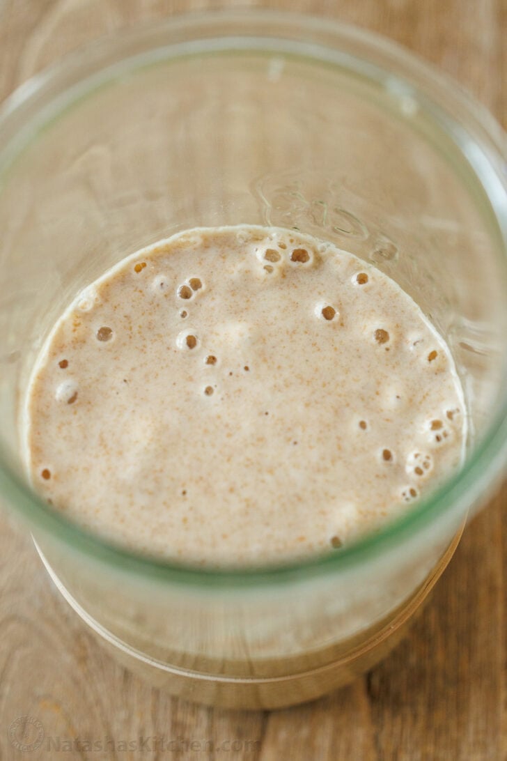 sourdough starter bubbling in jar