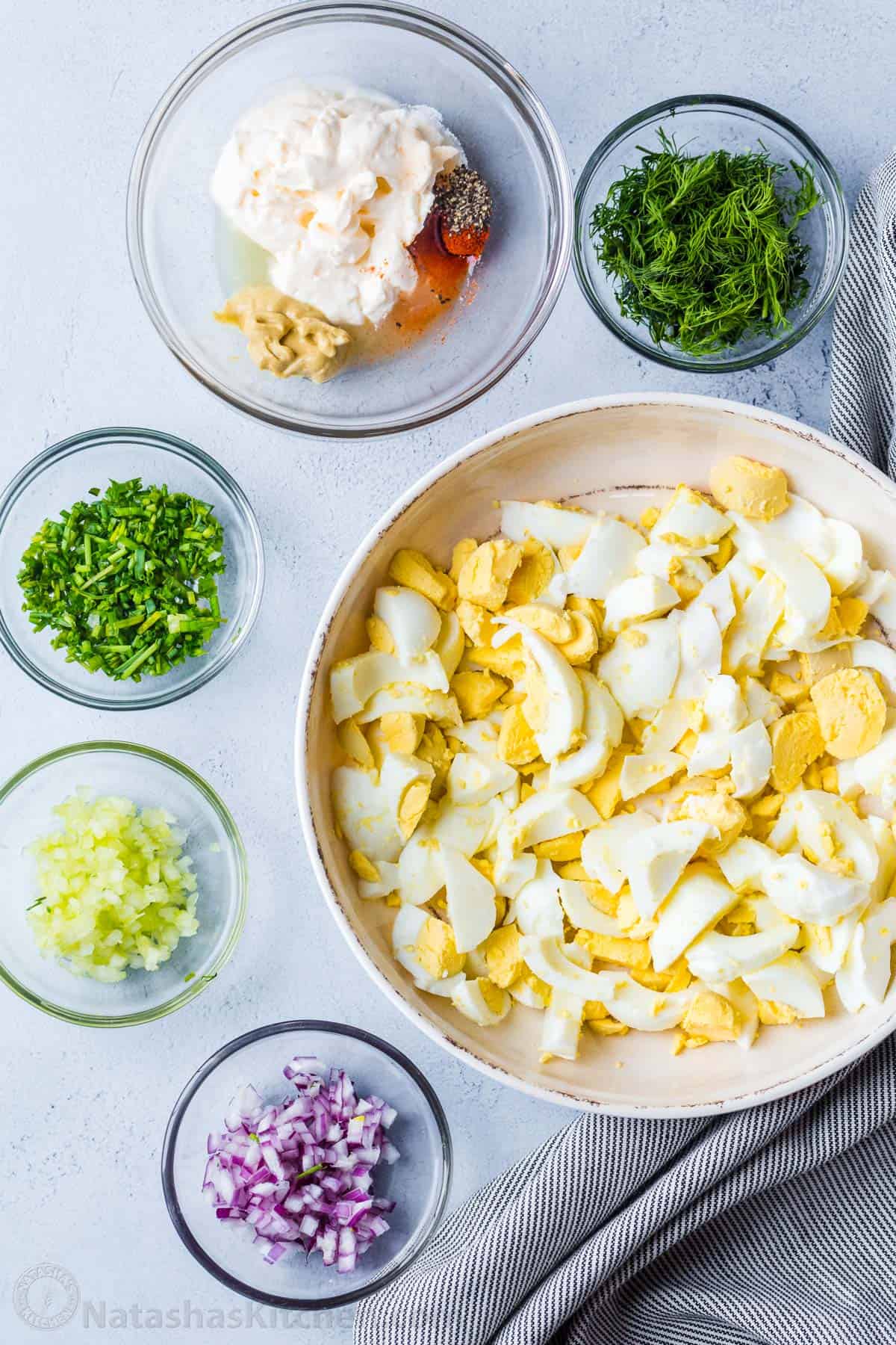 Chopped ingredients in individual bowls before mixing.