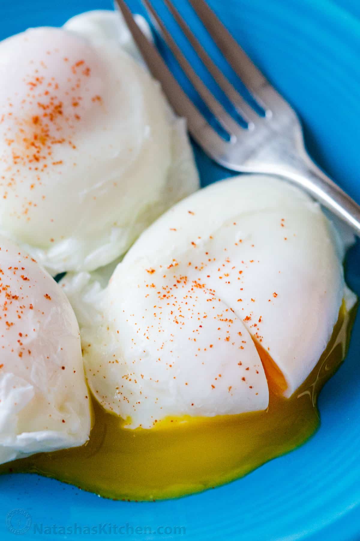 Poached egg recipe served on blue plate