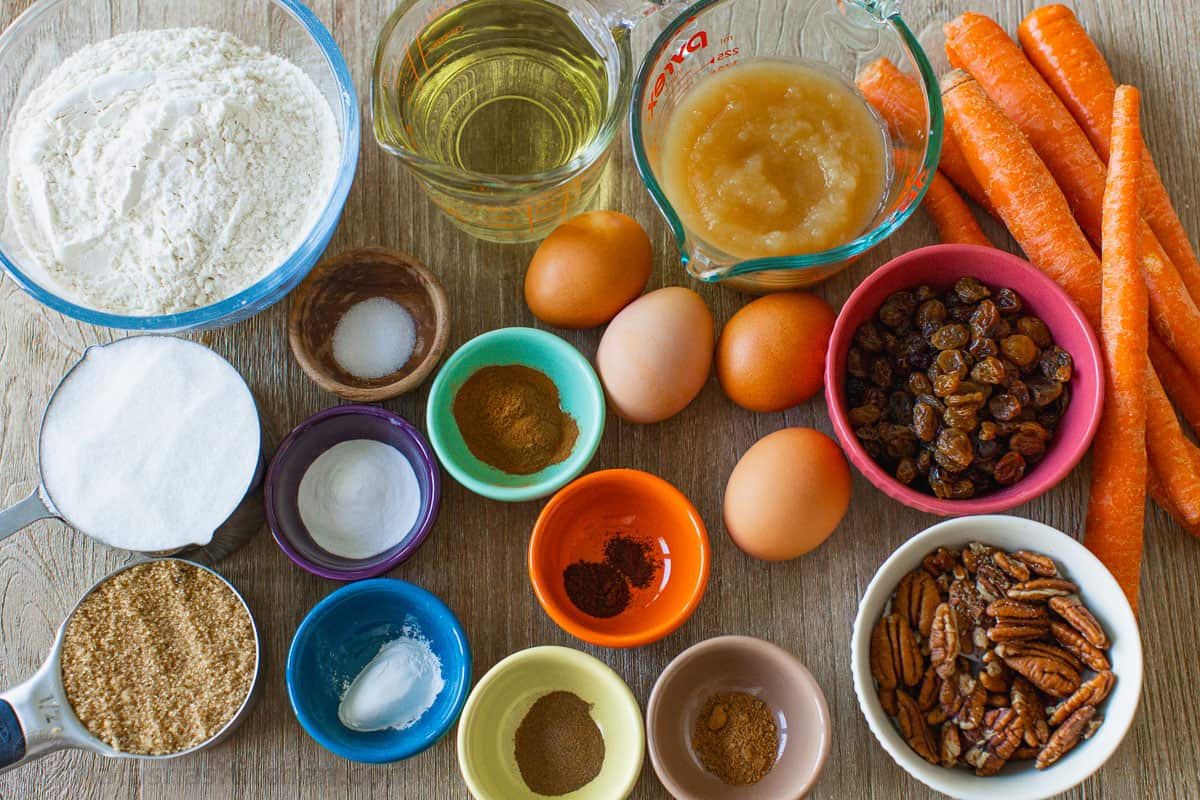 Ingredients for making a cake with carrots, pecans and raisins