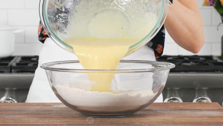 Pouring wet ingredients into dry ingredients