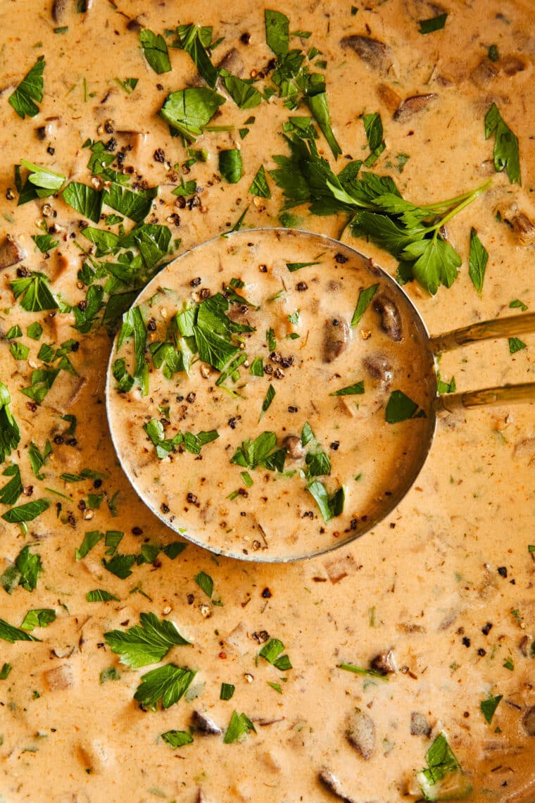 Hungarian Mushroom Soup - The creamiest mushroom soup with fresh dill, thyme, and paprika. Top with a dollop of sour cream and crusty bread!