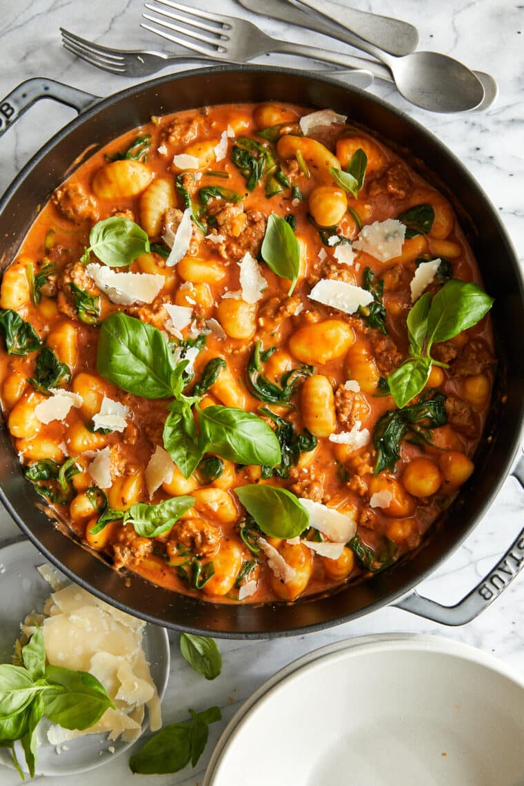 Creamy Sausage Gnocchi - A quick 30 min ONE POT meal! With crumbled Italian sausage, sneaked in spinach and the best tomato cream sauce ever!