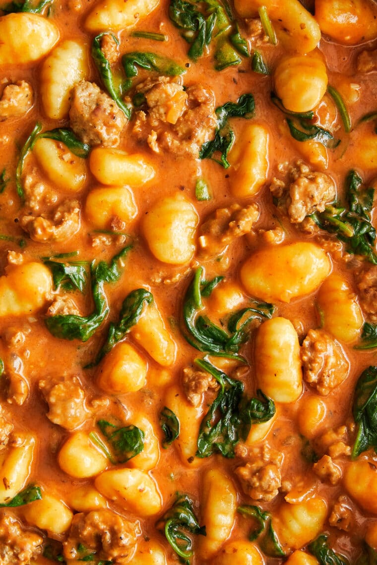 Creamy Sausage Gnocchi - A quick 30 min ONE POT meal! With crumbled Italian sausage, sneaked in spinach and the best tomato cream sauce ever!