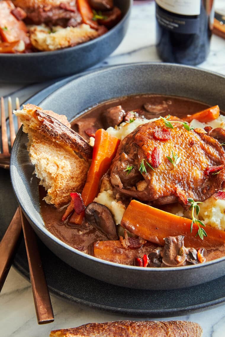 Instant Pot Coq Au Vin - Oh-so-perfect silky-tender chicken and veggies cooked in a red wine sauce in just a fraction of the time. SO GOOD!