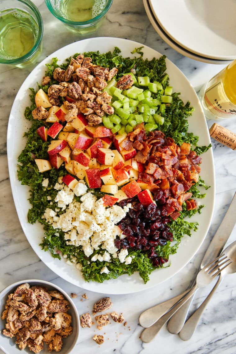 Apple Cranberry Pecan Salad - A bright, refreshing fall salad with apples, bacon + the most amazing candied pecans. Perfect for the holidays!