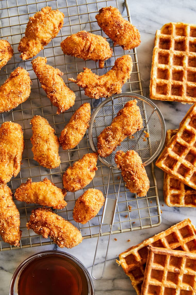 Pieces of crispy fried chicken, drizzled with a warm honey glaze and served with buttermilk waffles