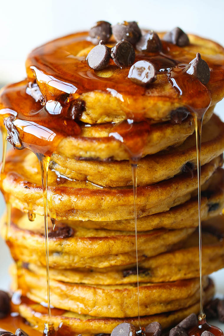 Pumpkin Chocolate Chip Pancakes - The most amazing pumpkin pancakes - so light + fluffy and made with semisweet chocolate chips. PERFECTION.