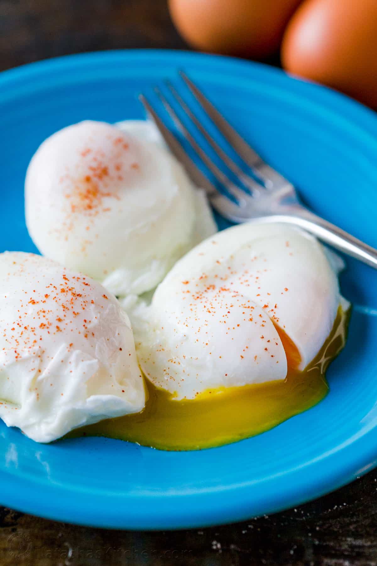 Poached Eggs served on a plate seasoned with paprika